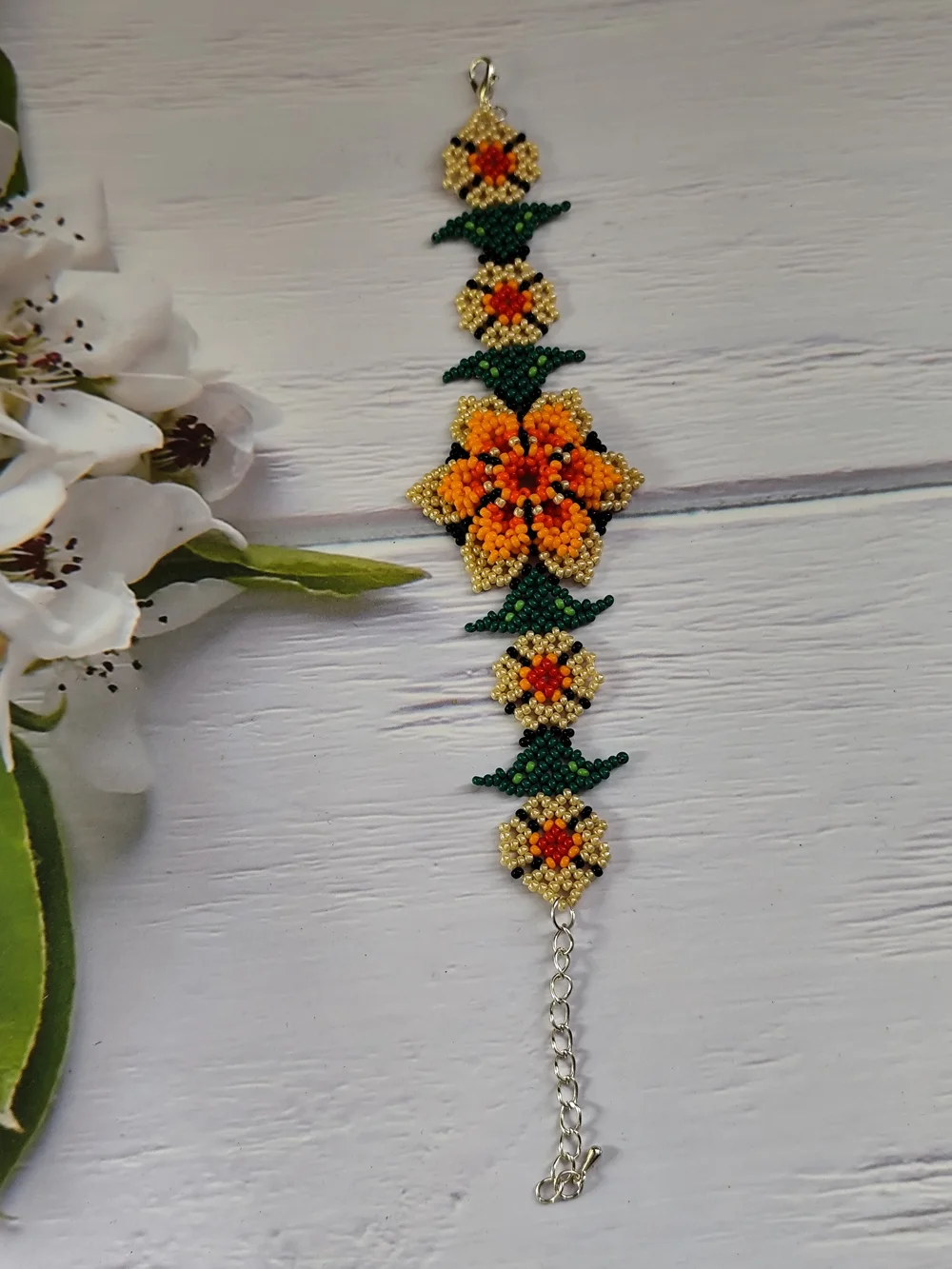 Vibrant Orange Floral Seed Bead Bracelet with Gold & Green Accents